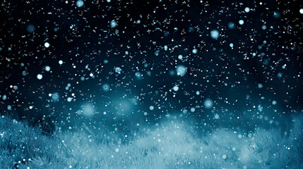 Snowflakes falling on a field under a blue sky