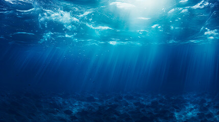 Sunlight filtering through deep blue ocean water - obrazy, fototapety, plakaty