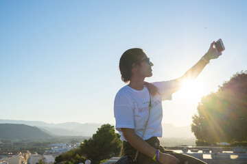 young woman taking a photo herself