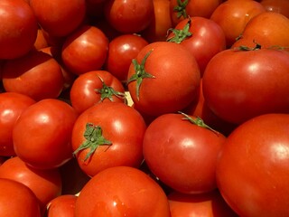 Full frame shot of many fresh red tomatoes in the indoor vegetable market, using for background