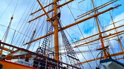 Bremerhaven - Windjammer - View into the rigging of a sailing ship with her masts and waving flags...