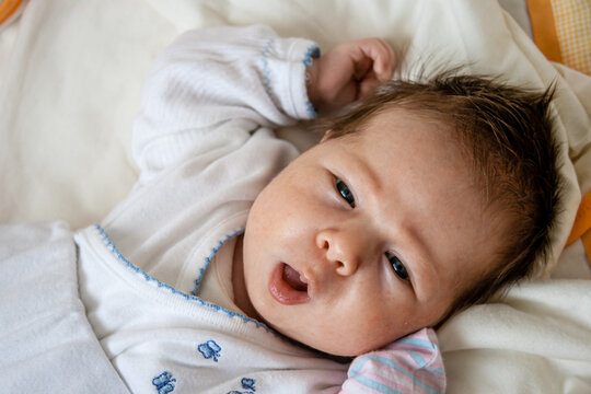 Charming Newborn Baby, Depicting a Natural and Calm Scene