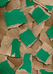 Texture from pieces of torn colored cardboard. Green brown carton background. Recycling concept....