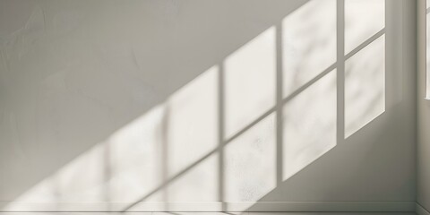 Light room wall with sunlight and shadows of the window