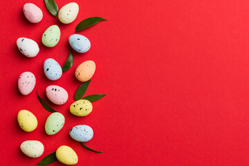 Happy Easter concept. Preparation for holiday. Easter eggs on colored background. flat lay top view copy space banner