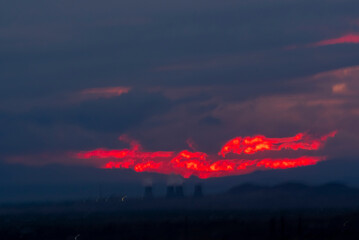 Cooling towers of nuclear power plant with stormy clouds in the background