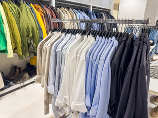new collection men's shirts on hanger in fashion store