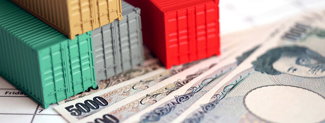 Obraz premium Global business container cargo ship in import export business logistic, Company shipping and logistics in Japan with yen money bills close up