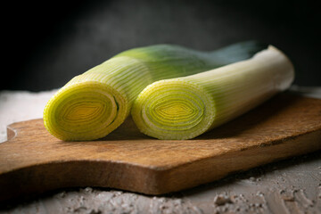 Sliced leek on a wooden board.