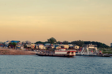 Naklejka na ściany i meble Sunset on Tonle Sap River, Mekong River in Phnom Penh City, Cambodia