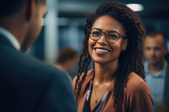 Mature Black Female Executive Engaging Team in Conference