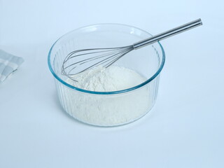 A close-up of some flour in a glass dish. March 1, 2024 - Paris, France.
