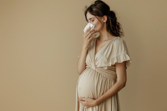 a pregnant woman has a cold. Snot. runny nose. flu. Allergy