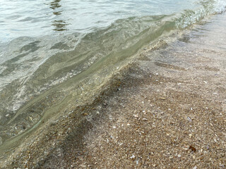 waves crashing on sand