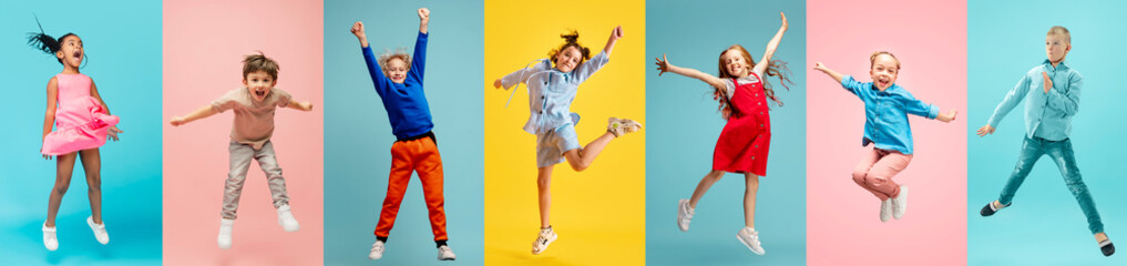 Full-length, Collage made of different children, boys and girls in motion, jumping, playing against multicolored background. Concept of childhood, kid's emotions, lifestyle, friendship - 773035094