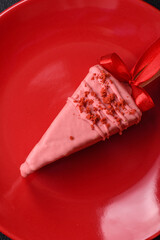 Delicious sweet cheesecake with fruits covered with icing with a wooden stick