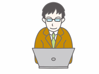 メガネをかけて茶色のスーツを着てパソコンをしている男性