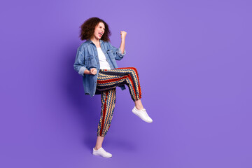 Full body portrait of pretty young woman raise fists empty space ad wear denim shirt isolated on...