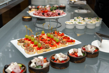 Buffet table with cold appetizers and salads.