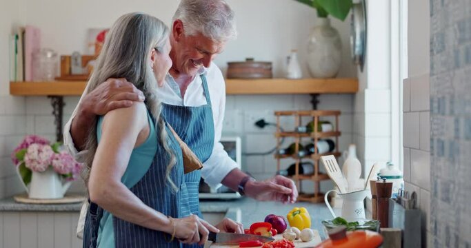 Woman, man and knife with vegetables in kitchen cooking for healthy nutrition for dinner, diet or conversation. Happy couple, meal prep and chat at counter for marriage bonding, fibre or ingredients