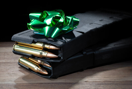 Loaded AR-15 magazines under a green bow