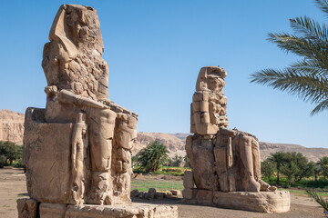 Fototapeta na wymiar Colossi of Memnon, Luxor, Ancient Egypt, Tourist Attractions