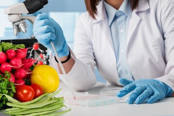 Female scientist work with microscope in laboratory
