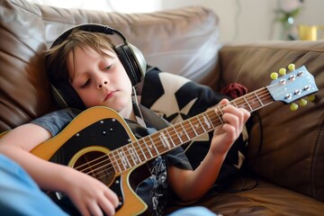 child with headphones strumming guitar at home