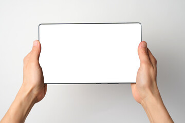 Close up of woman hand holding modern digital tablet mockup