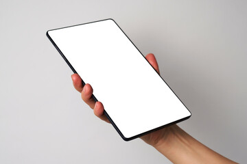 Close up of woman hand holding modern digital tablet mockup