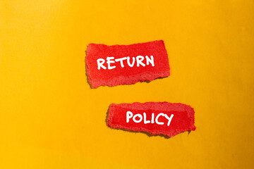 Return policy words written on red torn paper pieces with yellow background. Conceptual business...