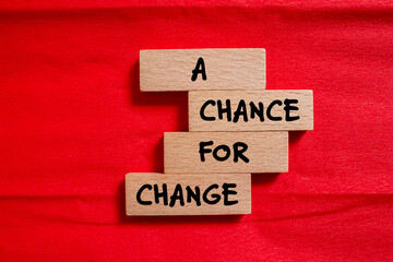 A chance for change words written on wooden blocks with red background. Conceptual symbol. Copy space.
