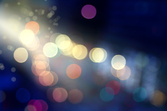 Blurry background image of defocused colorful abstract city street lights at night