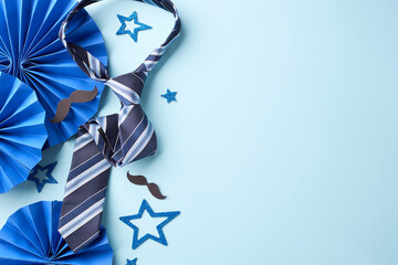 Festive Father's Day: A cheerful spread of a striped tie, paper fans, and glittery stars, artfully...