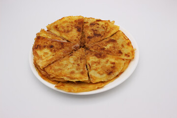 The image of very tasty meat pancakes on a white plate on a light background.