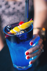 Female hand holding cocktail