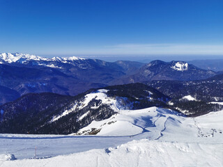 Majestic mountain ski slopes under a clear blue sky. - 773101615
