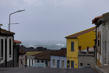 Stormy day in the Azores. Colorful houses in Ribeira Seca. Sao Miguel island, Azores, Portugal
