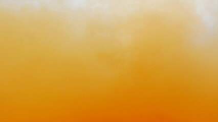 Orange color dye melt in water on white background,Abstract smoke pattern,Colored liquid dye,Splash...
