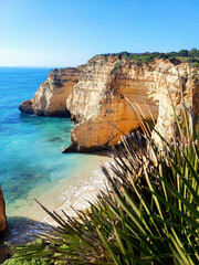 Coastal cliffs in Algarve, Portugal, illuminated by the bright afternoon sun