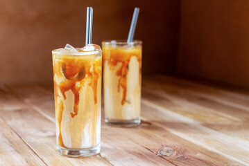 ice caramel macchiato coffee on  wooden table.