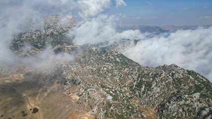 Aerial view of a majestic mountain range covered with clouds in Lebanon