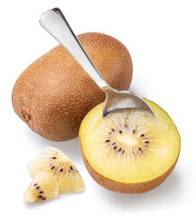 Golden kiwi fruit and spoon scooping out juicy flesh isolated on white background.