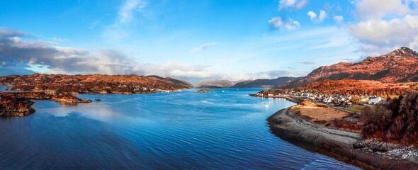 Aerial panoramic view of blue water with mountains on the shore in Kyle of Lochalsh, Scotland, UK
