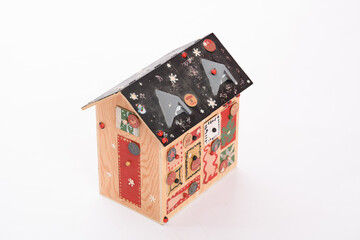 advent calendar in the shape of a homemade mountain chalet