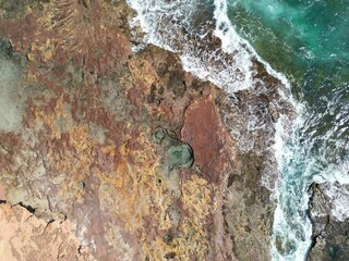 Ariel drone shot of ocean shore and waves, Eagle Gorge, Kalbarri National Park, Western Australia