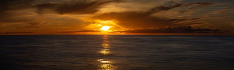 Stunning backdrop of a sun setting over the water