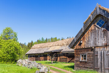 Old timber barn on the countryside a sunny summer day