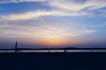 Fototapeta na wymiar Beautiful calm sunset over the sandy shore