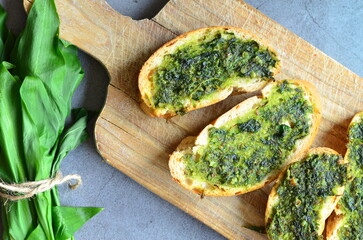 background of food prepared from wild wild garlic, green pesto, healthy food, seasonal food